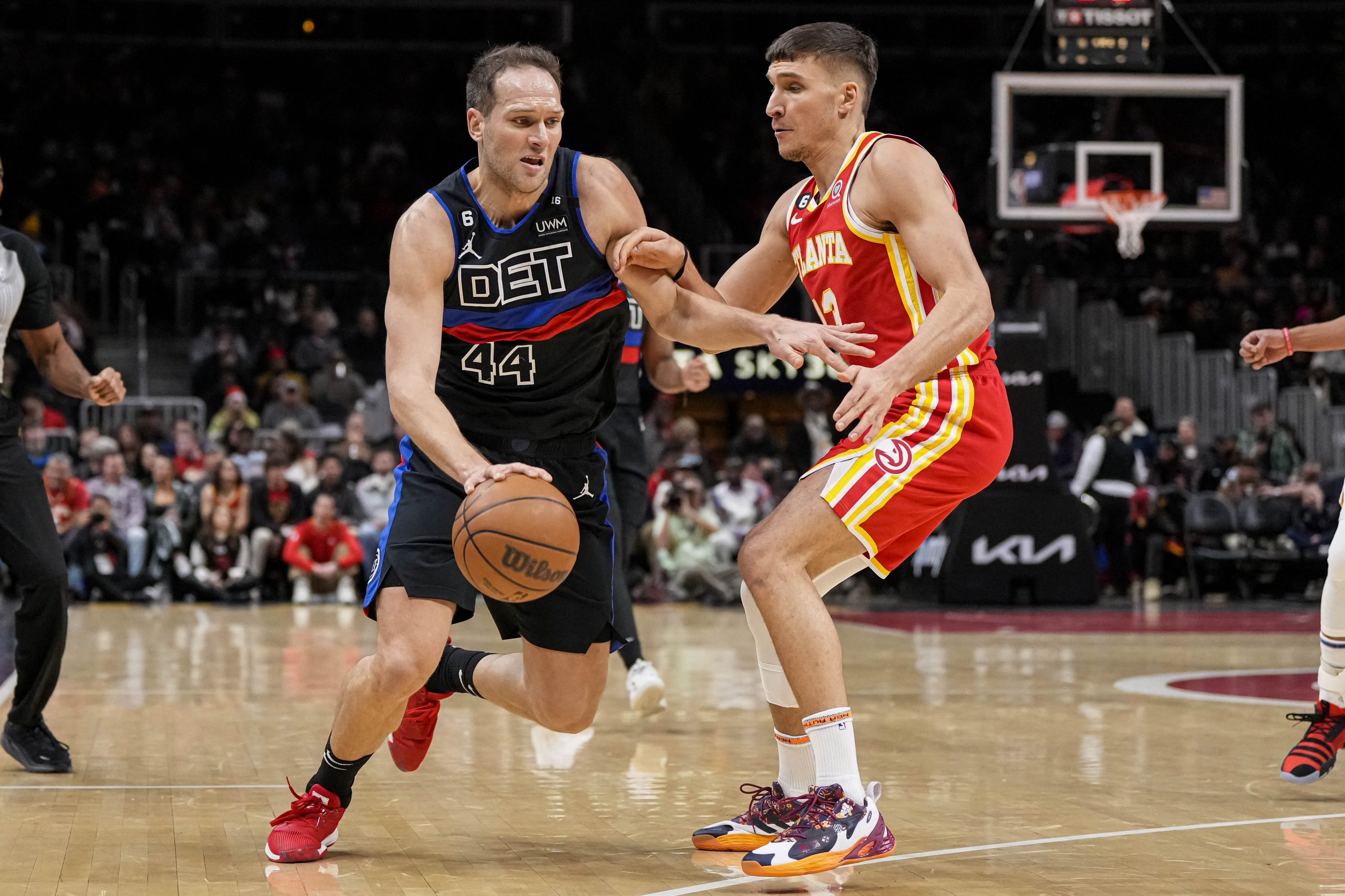Dec 23, 2022; Atlanta, Georgia, USA; Detroit Pistons forward Bojan Bogdanovic (44) dribbles defended by Atlanta Hawks guard Bogdan Bogdanovic (13) during the first half at State Farm Arena. Mandatory Credit: Dale Zanine-USA TODAY Sports