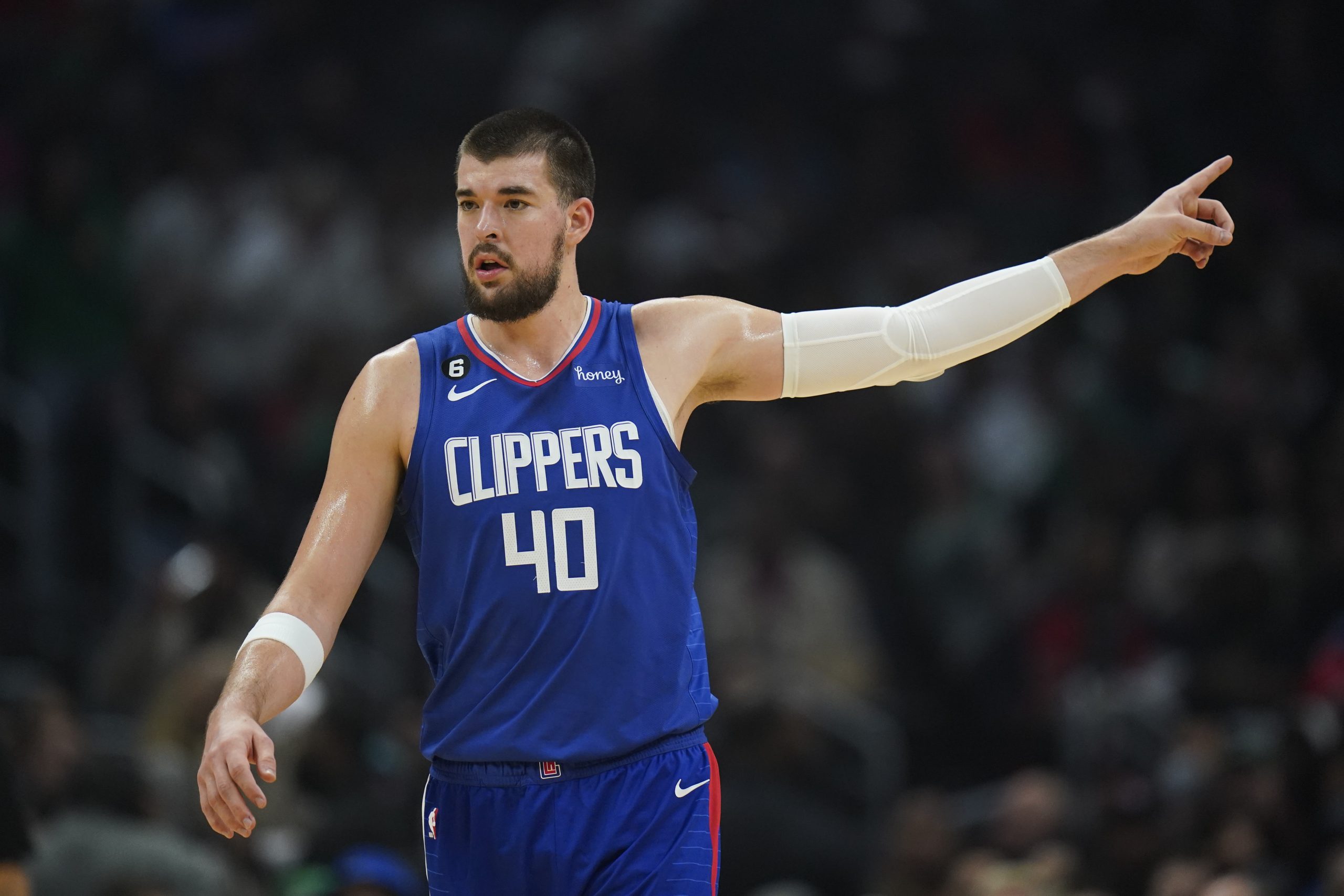 Los Angeles Clippers' Ivica Zubac talks to a teammate during first half of an NBA basketball game against the Boston Celtics Monday, Dec. 12, 2022, in Los Angeles. (AP Photo/Jae C. Hong)