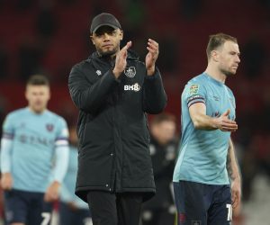 Burnley's manager Vincent Kompany applauds his teams fans after the end of the English League Cup 4th round soccer match between Manchester United and Burnley, at Old Trafford in Manchester, England Wednesday, Dec. 21, 2022. United won the game 2-0. (AP Photo/Dave Thompson)