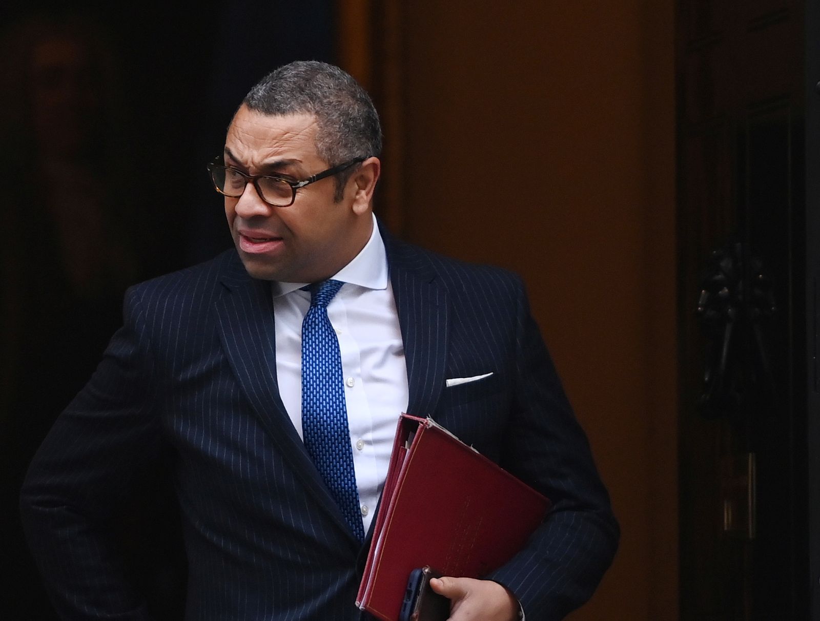 epa10310208 British Foreign Secretary James Cleverly leaves Downing Street following a cabinet meeting in London, Britain, 17 November 2022. British Chancellor of the Exchequer Jeremy Hunt is to deliver his Autumn Statement to parliament on 17 November, with tax rises and government spending cuts expected to help fill a 50 billion pounds black hole in the British finances.  EPA/ANDY RAIN