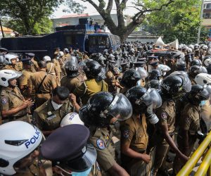 epa10312751 Sri Lankan riot police try to disperse a protest march demanding the release of protesters who had been detained under the Preventive Terrorism Act (PTA) in front of the United Nations compound in Colombo, Sri Lanka, 18 November 2022. Thousands of protesters staged a protest march to the United Nations compound in Colombo, demanding the release of protesters who had been detained under the Preventive Terrorism Act (PTA) for 90 days and against the government's crackdown on anti-government protesters using the PTA. Protests have been rocking Sri Lanka for over seven months as the country faces its worst-ever economic crisis in decades due to the lack of foreign reserves, resulting in severe shortages in food, fuel, medicine, and imported goods.  EPA/CHAMILA KARUNARATHNE