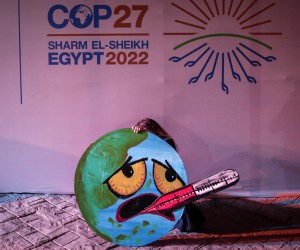 epa10315106 An activist holds a sign at the 2022 United Nations Climate Change Conference (COP27), in Sharm El-Sheikh, Egypt, 19 November 2022. The 2022 United Nations Climate Change Conference (COP27), runs from 06 to 18 November, and is expected to host one of the largest number of participants in the annual global climate conference as over 40,000 estimated attendees, including heads of states and governments, civil society, media and other relevant stakeholders will attend. The events will include a Climate Implementation Summit, thematic days, flagship initiatives, and Green Zone activities engaging with climate and other global challenges.  EPA/SEDAT SUNA  EPA-EFE/SEDAT SUNA