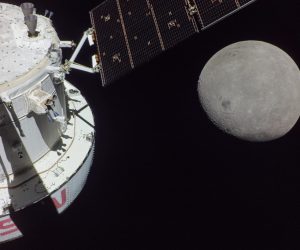 epa10320024 A handout photo made available by the NASA shows a portion of the far side of the Moon looms large just beyond the Orion spacecraft in this image taken on the sixth day of the Artemis I mission by a camera on the tip of one of Orion's solar arrays on 21 November 2022 (issued 22 November 2022). The spacecraft entered the lunar sphere of influence on 20 November making the Moon instead of Earth the main gravitational force acting on the spacecraft On 21 November iit came within 80 miles of the lunar surface the closest approach of the uncrewed Artemis I mission before moving into a distant retrograde orbit around the Moon. The darkest spot visible near the middle of the image is Mare Orientale.  EPA/NASA HANDOUT  HANDOUT EDITORIAL USE ONLY/NO SALES