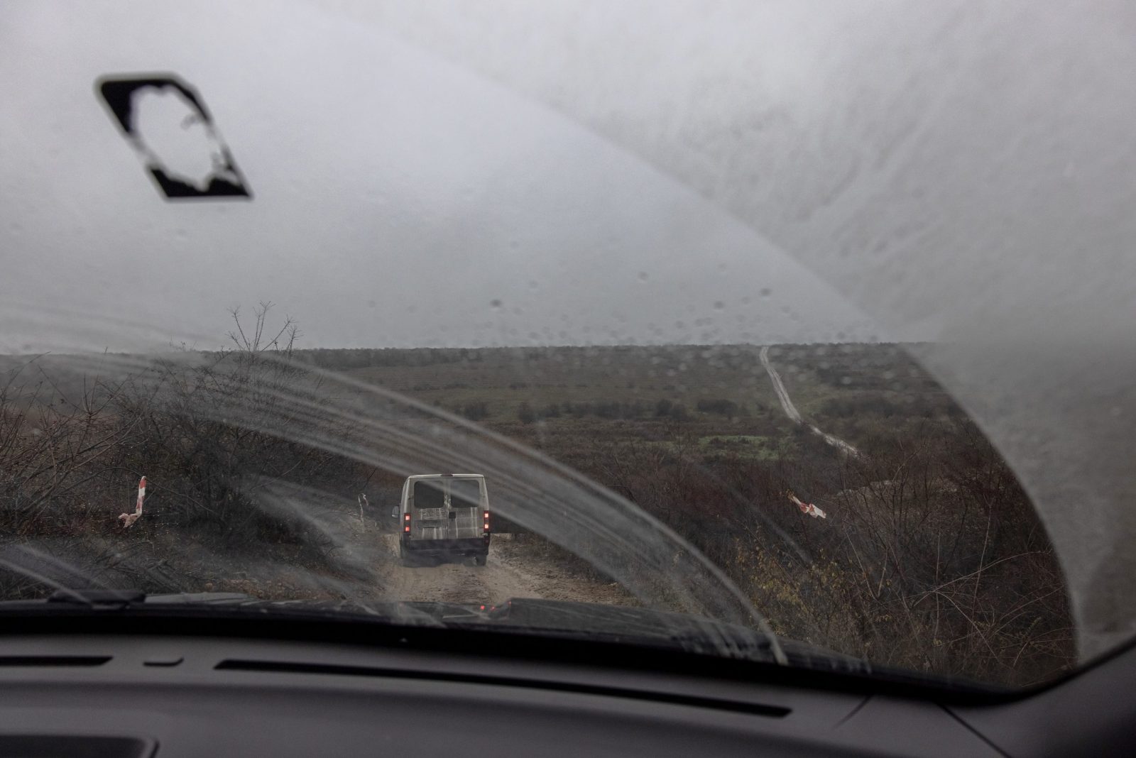 epa10331804 Volunteers drive in a minivan to remote frontline villages to deliver humanitarian aid and evacuate people in Kherson region, southern Ukraine, 26 November 2022 (issued 27 November 2022). The Ukrainian president accused the Russian army of deliberately destroying critical infrastructure during their withdrawal from the city of Kherson, including electricity and water supplies. Ukrainian troops entered Kherson on 11 November after the Russian army had withdrawn from the city which they captured in the early stage of the conflict, shortly after Russian troops had entered Ukraine in February 2022.  EPA/ROMAN PILIPEY