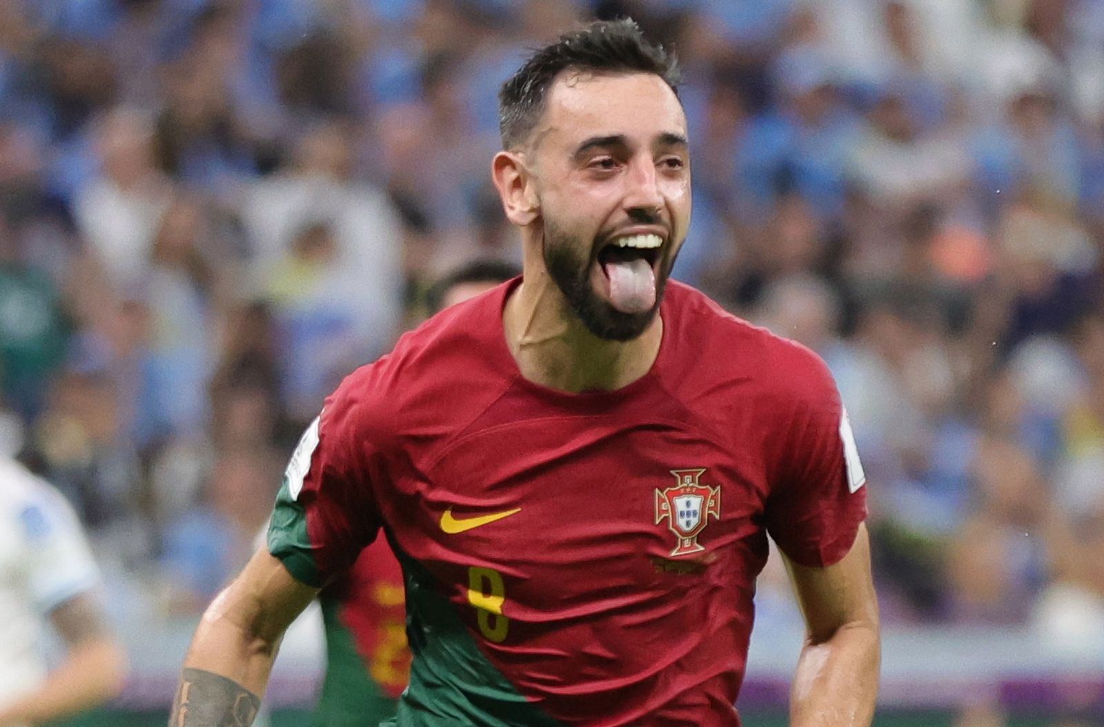 epa10335374 Bruno Fernandes of Portugal celebrates after scoring the 2-0 during the FIFA World Cup 2022 group H soccer match between Portugal and Uruguay at Lusail Stadium in Lusail, Qatar, 28 November 2022.  EPA/Abir Sultan