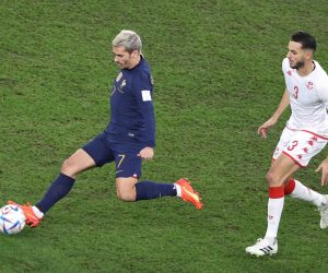 epa10339288 Antoine Griezmann (L) of France in action against Montassar Talbi of Tunisia during the FIFA World Cup 2022 group D soccer match between Tunisia and France at Education City Stadium in Doha, Qatar, 30 November 2022.  EPA/Mohamed Messara