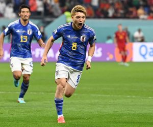 epa10342780 Ritsu Doan of Japan celebrates after scoring the 1-1 during the FIFA World Cup 2022 group E soccer match between Japan and Spain at Khalifa International Stadium in Doha, Qatar, 01 December 2022.  EPA/Neil Hall