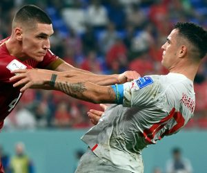 epa10345314 Nikola Milenkovic (L) of Serbia and Xherdan Shaqiri of Switzerland scuffle during the FIFA World Cup 2022 group G soccer match between Serbia and Switzerland at Stadium 947 in Doha, Qatar, 02 December 2022.  EPA/Georgi Licovski