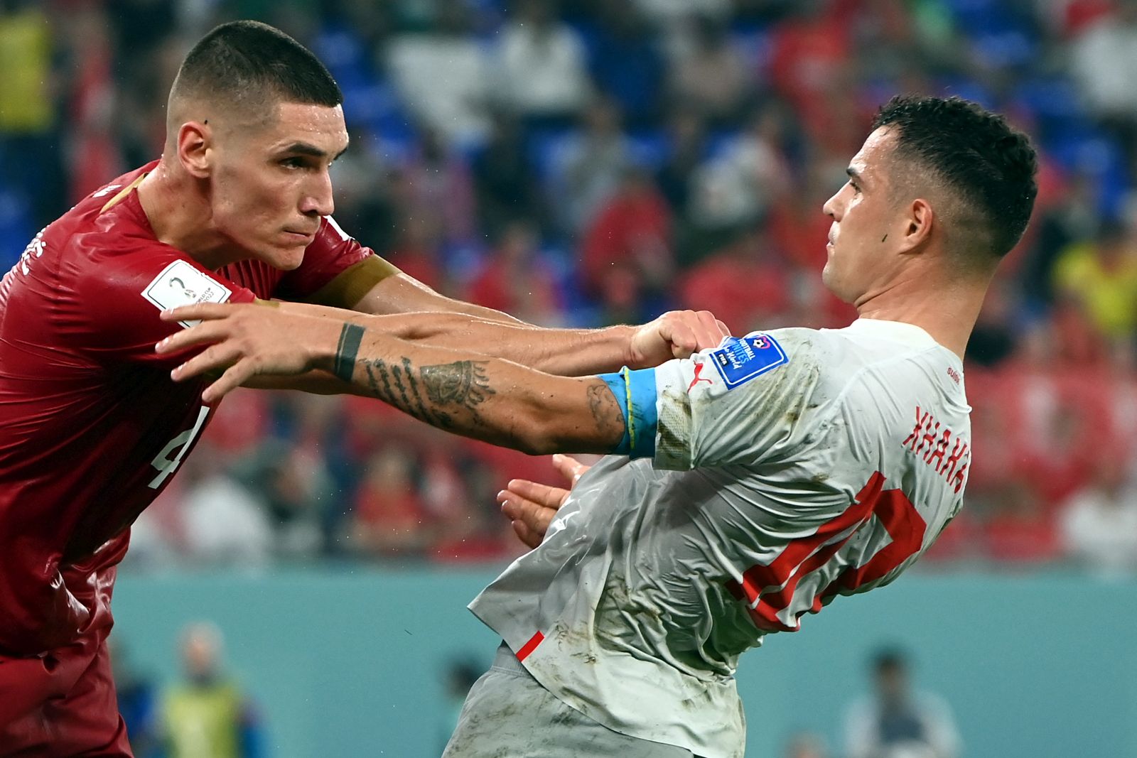 epa10345314 Nikola Milenkovic (L) of Serbia and Xherdan Shaqiri of Switzerland scuffle during the FIFA World Cup 2022 group G soccer match between Serbia and Switzerland at Stadium 947 in Doha, Qatar, 02 December 2022.  EPA/Georgi Licovski