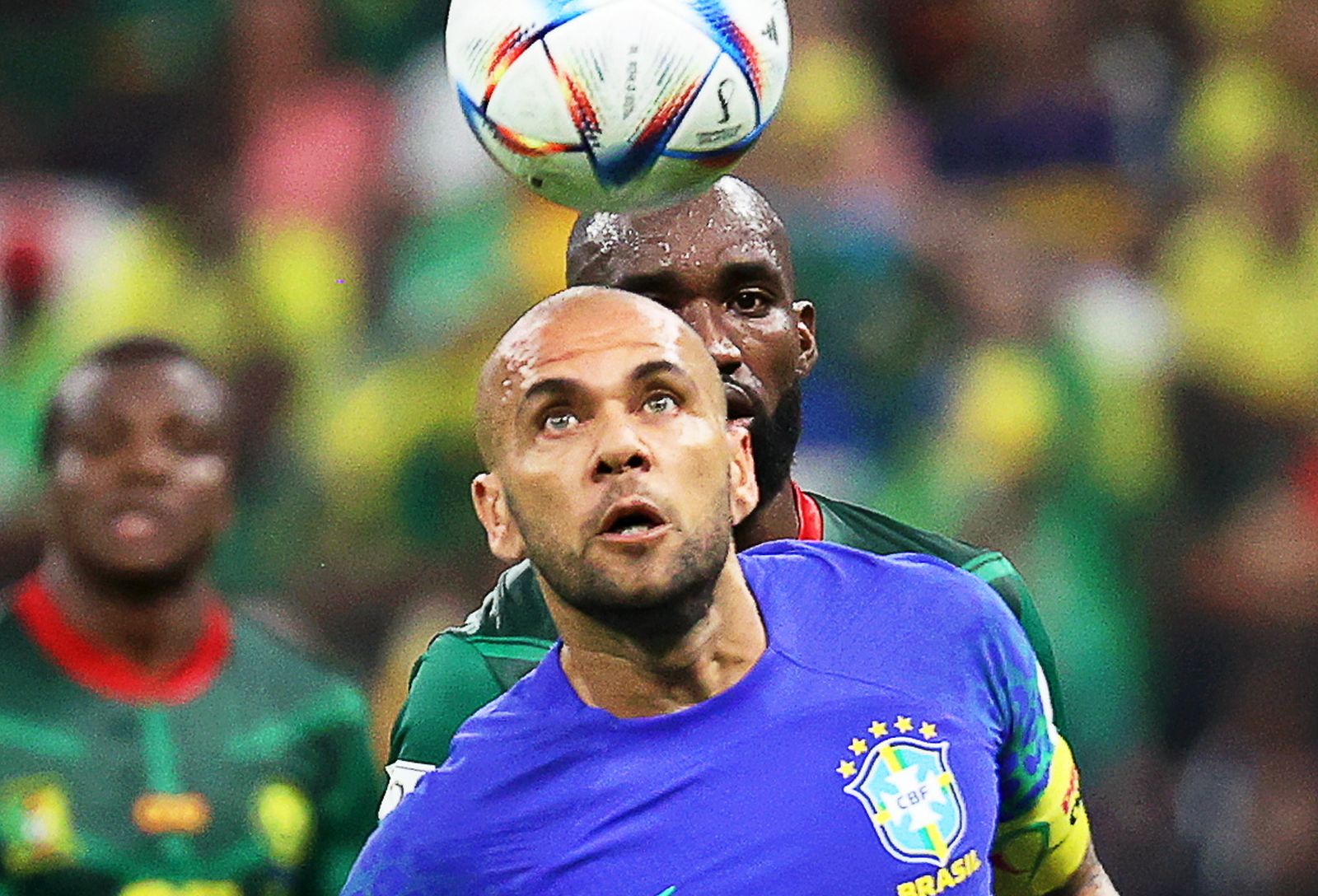 epa10345162 Dani Alves (front) of Brazil in action during the FIFA World Cup 2022 group G soccer match between Cameroon and Brazil at Lusail Stadium in Lusail, Qatar, 02 December 2022.  EPA/Abedin Taherkenareh