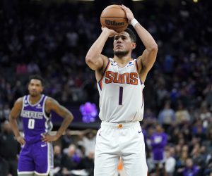 epa10335703 Phoenix Suns guard Devin Booker (R) shoots a free throw as Sacramento Kings guard Malik Monk (L) looks on during the second half of the NBA game at Golden 1 Center in Sacramento, California, USA, 28 November 2022.  EPA/JOHN G. MABANGLO  SHUTTERSTOCK OUT
