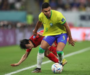 epa10350513 Casemiro (R) of Brazil in action against Moonhwan Kim of South Korea during the FIFA World Cup 2022 round of 16 soccer match between Brazil and South Korea at Stadium 974 in Doha, Qatar, 05 December 2022.  EPA/Tolga Bozoglu