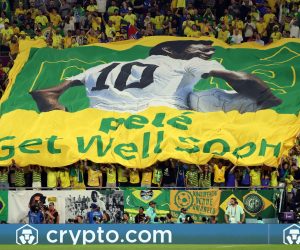 epa10350658 Fans of Brazil show a banner with which they wish Pele all the best during the FIFA World Cup 2022 round of 16 soccer match between Brazil and South Korea at Stadium 974 in Doha, Qatar, 05 December 2022.  EPA/Abedin Taherkenareh