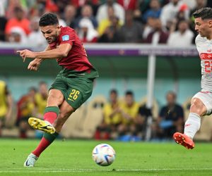 epa10352602 Goncalo Ramos (L) of Portugal scores the 1-0 during the FIFA World Cup 2022 round of 16 soccer match between Portugal and Switzerland at Lusail Stadium in Lusail, Qatar, 06 December 2022.  EPA/Noushad Thekkayil