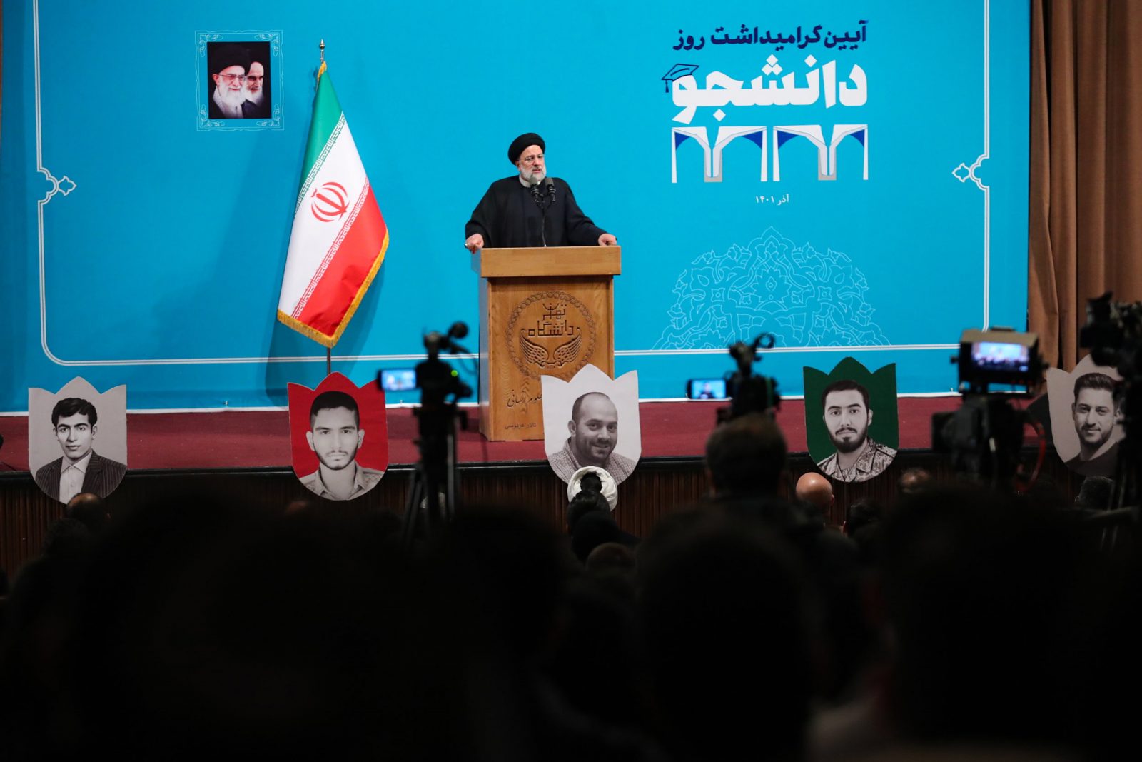 epa10353421 A handout photo made available by the Iranian presidential office shows, Iranian president Ebrahim Raisi speaking to students as he arrives during a ceremony on the occasion of 'Student Day' at the Tehran University, in Tehran, Iran, 07 December 2022. Student Day commemorates the anniversary of the murder of three students of the University of Tehran on 07 December 1953 by Iranian police. Raisi said that the universities are the key for the country as the enemies targeted the universities during the protests. Iran has been facing anti-government protests for more than two month and the universities were one of the main spots.  EPA/HANDOUT  HANDOUT EDITORIAL USE ONLY/NO SALES
