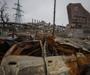 epaselect epa10354150 A destroyed monument with Azovstal logo at the main entrance to the Azovstal steel plant in Mariupol, eastern Ukraine, 07 December 2022. In April 2022, the Ukrainian forces that were still in the city, had retreated inside the Azovstal complex site. Mariupol had seen a long battle for its control between the Ukrainian forces and the Russian army and Russian backed separatist Donetsk People’s Republic (DPR) as well as a siege, the hostilities lasted from February to the end of May 2022 killing thousands of people and destroying most of the city in the process. According to the DPR government which took control after May 2022, more than five thousand builders are currently working in Mariupol, they expect the city to be completely rebuilt in a three years time.  EPA/SERGEI ILNITSKY