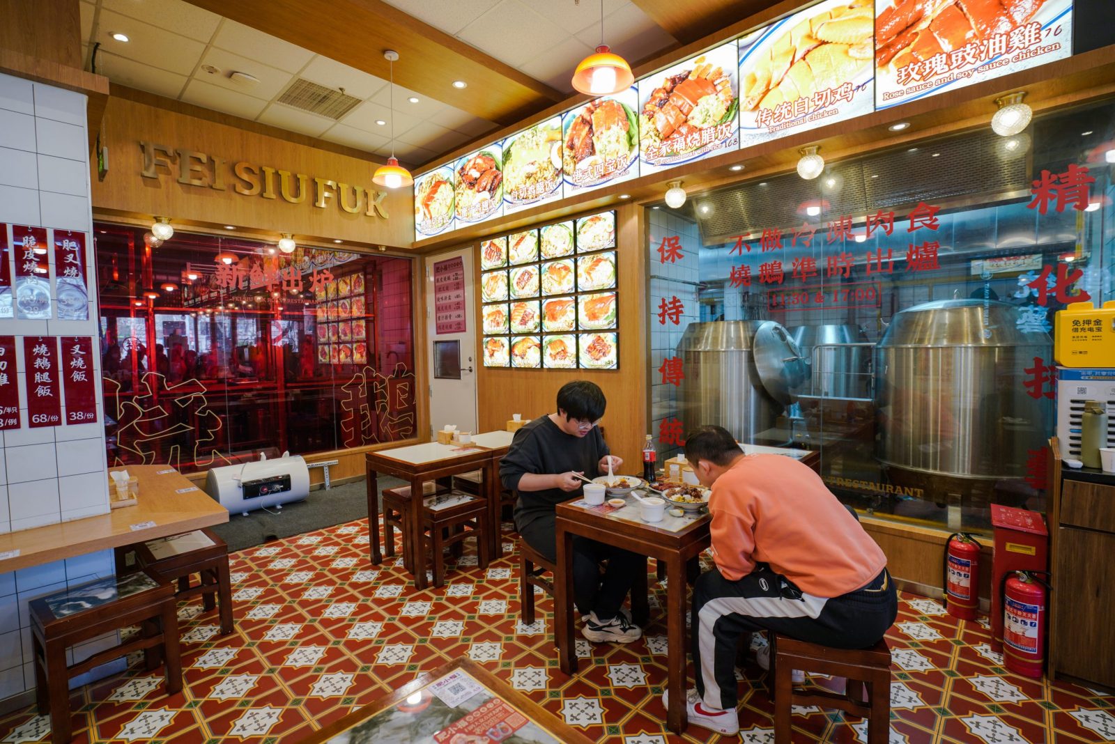 epa10354531 People dine in a restaurant in Beijing, China, 08 December 2022. Despite daily cases increasing, Chinese officials announced an easing of the COVID-19 restriction measures on 07 December 2022, lockdown measures now only targets buildings, units or floors rather than whole residential compounds or cities, while Beijing restaurants restored dine-in services. People now need COVID-19 negative results taken within 48 hours to dine in.  EPA/WU HAO