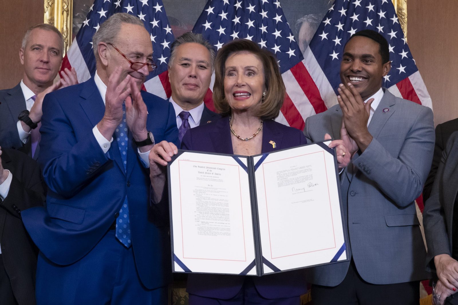 epa10355413 US Speaker of the House Nancy Pelosi (C) holds up the bill beside Democratic Representative of New York Sean Maloney (L), Senate Majority Leader Chuck Schumer (2-L), Democratic Representative of California Mark Takano (3-L) and Democratic Representative from New York Ritchie Torres (R); during a bill enrollment ceremony for H.R. 8404, the 'Respect For Marriage Act', on Capitol Hill in Washington, DC, USA, 08 December 2022. The House passed the Respect for Marriage Act, which after being signed into law by US President Joe Biden, will protect same-sex and interracial marriages.  EPA/MICHAEL REYNOLDS