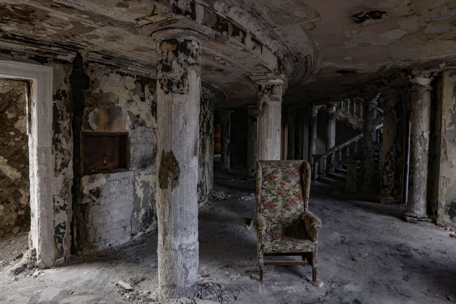 epa10355692 An armchair sits inside the destroyed Drama Theatre in Mariupol, Ukraine, 08 December 2022. The Mariupol Drama Theater was destroyed on 16 March during Russian airstrikes and the siege of the city. The restoration of the theater by Russian specialists began in September and is scheduled to finished within three years. More than 5,000 builders are currently working on the restoration of the city, the number of personne is to be increased to 30,000 by spring 2023. Mariupol is expected to be completely rebuilt in three years.  EPA/SERGEI ILNITSKY