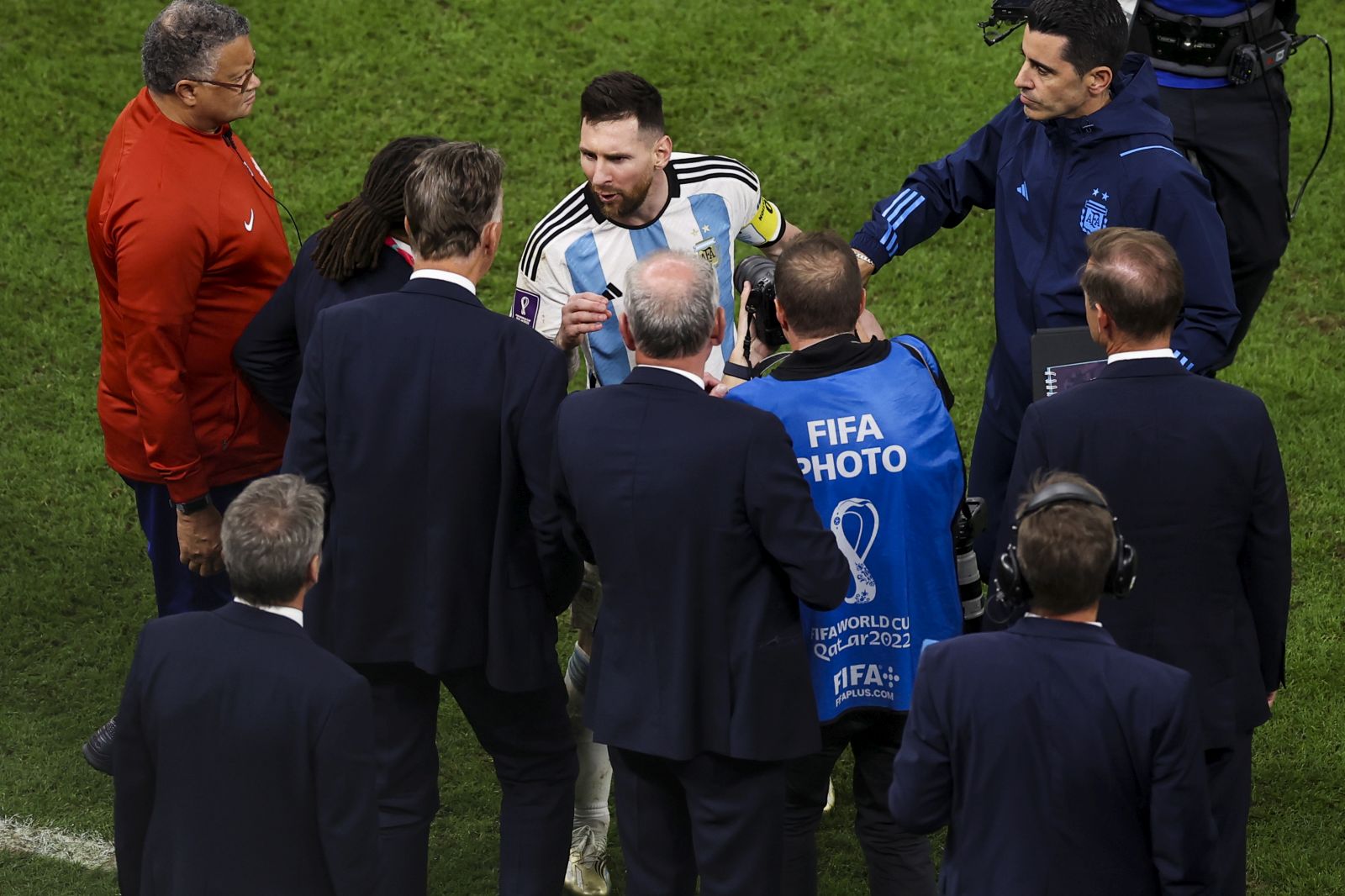 epa10358388 Lionel Messi of Argentina speaks to Netherlands head coach Louis Van Gaal and assistant coach Edgar Davids at the end of their FIFA World Cup 2022 quarter final match between the Netherlands and Argentina, at Lusail Stadium, Lusail, Qatar, 09 December 2022.  EPA/JOSE SENA GOULAO