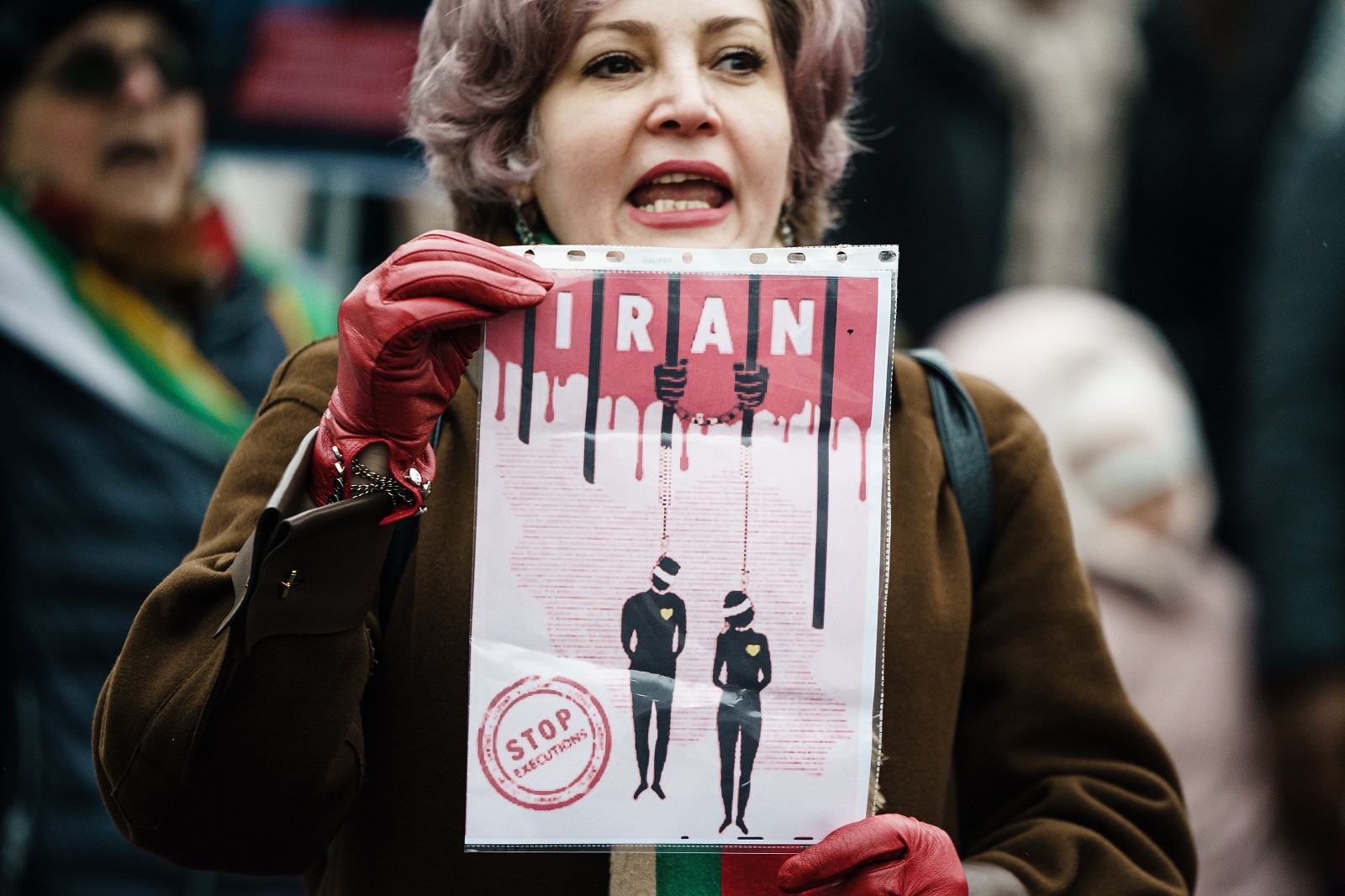 epa10359146 A woman holds a placard during a rally in Berlin, Germany, 10 December 2022. The women and girls rights non-profit-organization Terre des Femmes and other groups called for a rally in solidarity with protesters in Iran, on the occasion of the international Human Rights Day. Further rallies were expected to take place in Hamburg, Cologne, Frankfurt, Stuttgart und Munich.  EPA/CLEMENS BILAN