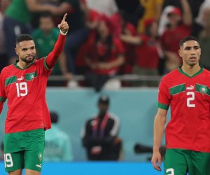 epa10359361 Youssef En-Nesyri of Morocco (L) celebrates scoring the 1-0 during the FIFA World Cup 2022 quarter final soccer match between Morocco and Portugal at Al Thumama Stadium in Doha, Qatar, 10 December 2022.  EPA/Friedemann Vogel