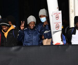 epa10360703 Migrants, among 248 migrants on board Ship Geo Barents, look on upon arrival at Salerno's harbor, southeast of Naples, Italy, 11 December 2022. Migrant rescue ship Geo Barents, operated by the Doctors Without Borders (MSF) organization, was allowed to dock at Salerno port to disembark the 248 survivors currently on board, including women and children, the NGO said.  EPA/Massimo Pica ITALY OUT