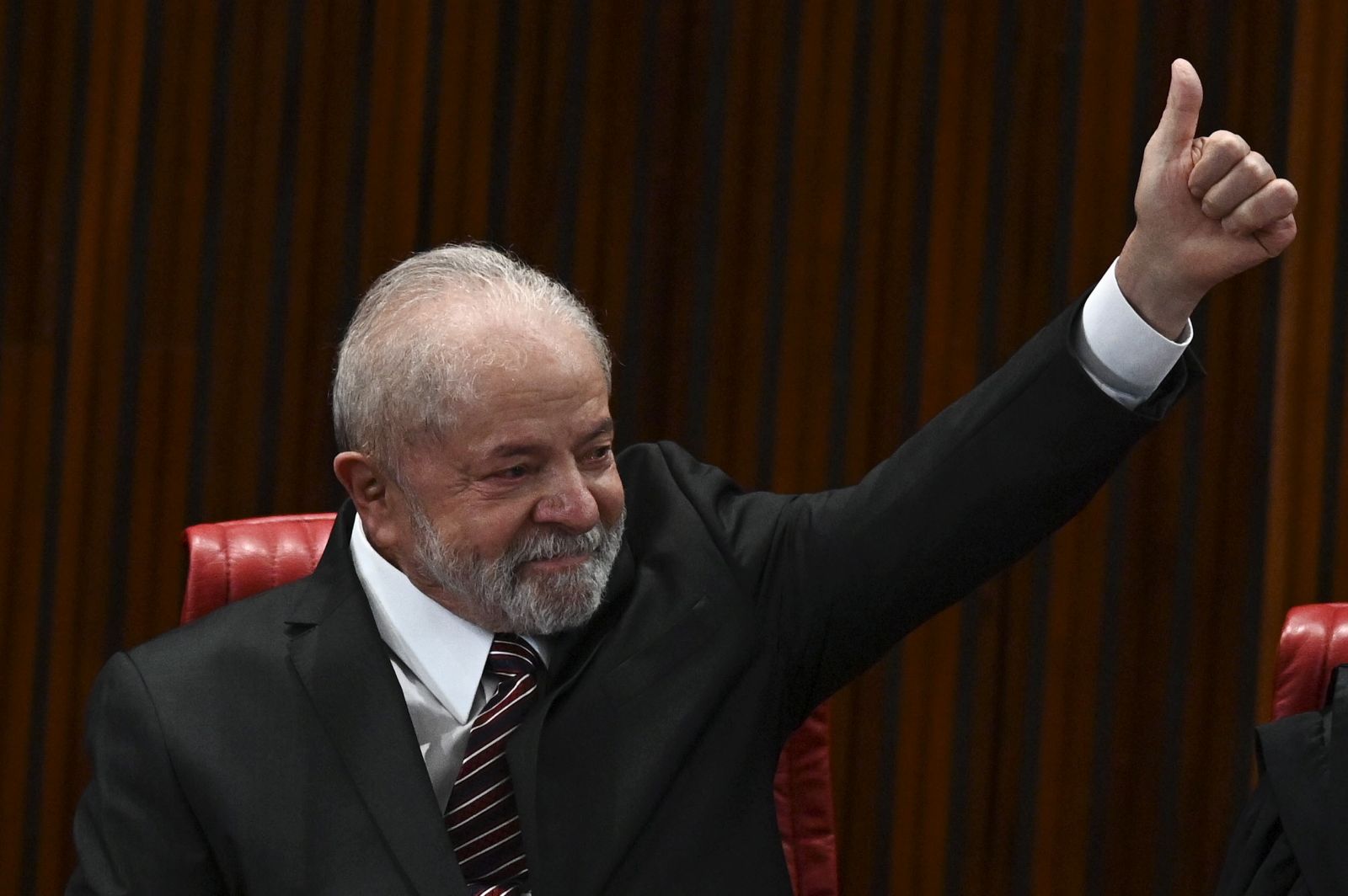 epa10362368 President-elect of Brazil Luiz Inacio Lula da Silva reacts as he receives from the president of the Superior Electoral Tribunal (TSE) Alexandre de Moraes the diploma that certifies him as the winner of the presidential elections at the headquarters of the TSE, in Brasilia, Brazil, 12 December 2022.  EPA/ANDRE BORGES