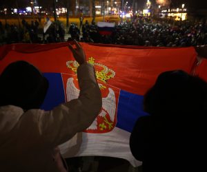 epa10362546 Protesters hold a Serbian flag during a march of support for Serbian population in Kosovo, in Belgrade, Serbia, 12 December 2022. Tensions between Kosovo and Serbia expanded after ethnic Serbs in Kosovo's north built road-blocks on the main roads in a protest after the arrest of a former Kosovo police officer of Serbian ethnicity on charges of terrorism.  EPA/ANDREJ CUKIC