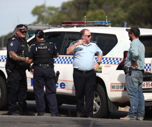 epa10362634 Police work near the scene of a fatal shooting in Wieambilla, Queensland, Australia, 13 December 2022. Police have shot dead three people at a remote property on Queensland's Darling Downs after an ambush in which two officers and a bystander were killed.  EPA/JASON O’BRIEN  AUSTRALIA AND NEW ZEALAND OUT