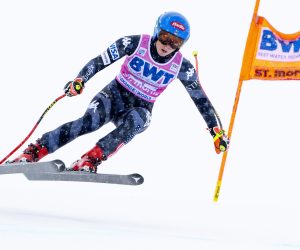 epa10368325 Mikaela Shiffrin of the USA cuts a gate during the women's Downhill race at the FIS Alpine Skiing World Cup in St. Moritz, Switzerland, 16 December 2022.  EPA/JEAN-CHRISTOPHE BOTT