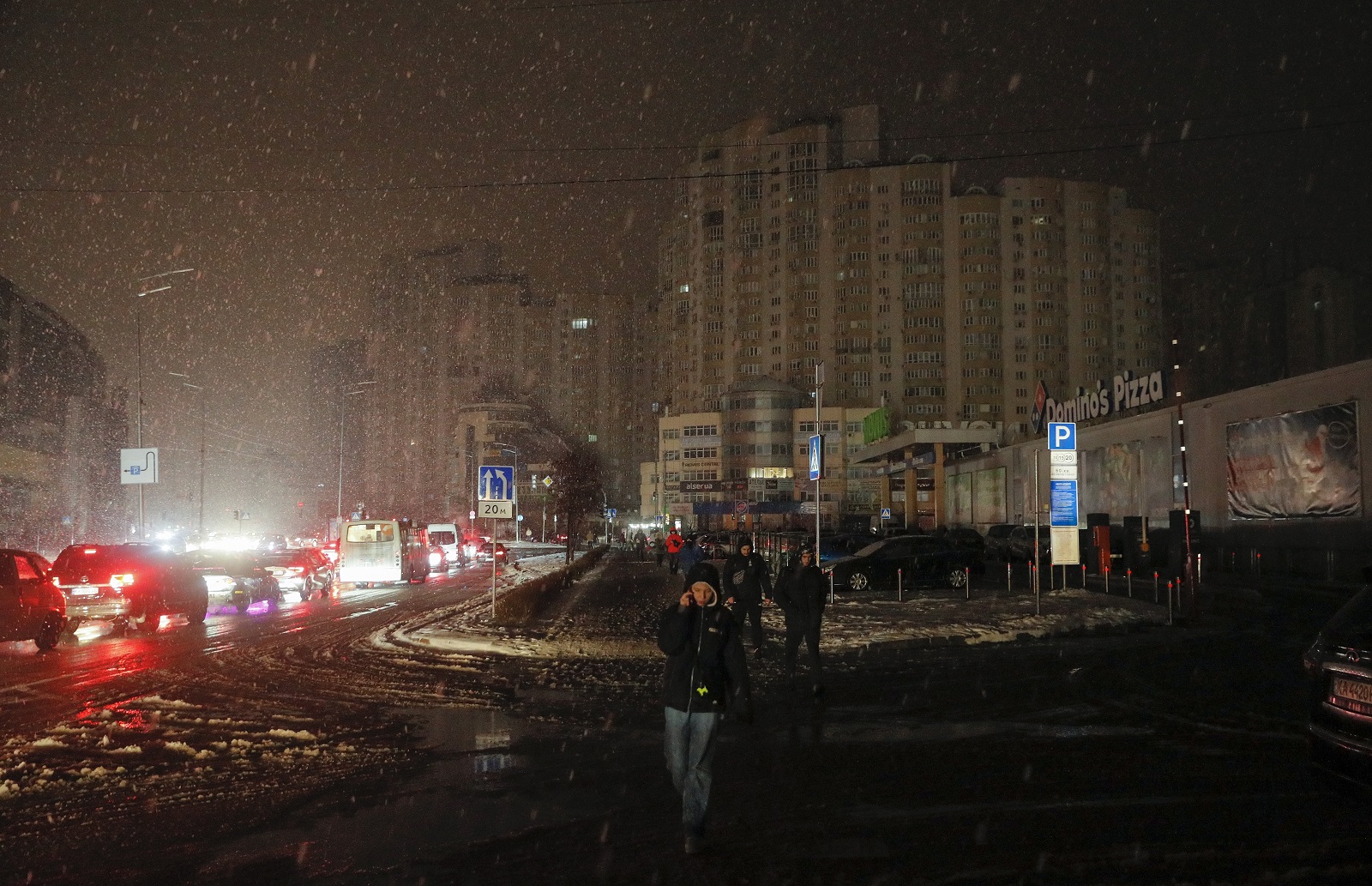 epa10368981 Residents walk along a dark street as electricity is cut after a massive rocket attack in Kyiv (Kiev), Ukraine, 16 December 2022 amid Russia's invasion. According to the Kyiv Military Administration, about 40 missiles were recorded on the day in the Ukrainian capital's airspace, 37 of which were shot down. A wave of Russian missile attacks on 16 December targeted the Ukrainian capital Kyiv and other parts of the country. Russian troops on 24 February entered Ukrainian territory, starting a conflict that has provoked destruction and a humanitarian crisis.  EPA/SERGEY DOLZHENKO