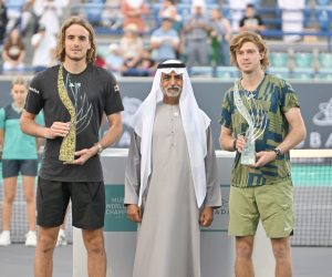 epa10371889 Winner Stephanos Tsitsipas of Greece (L) and runner up Andrey Rublev of Russia (R) with H.E. Sheikh Nahya Bin Mubarak Al Nahyan (C) after the Men’s Championship Match at the Mubadala World Tennis Championship exhibition tournament in Abu Dhabi, United Arab Emirates, 18 December 2022.  EPA/STR
