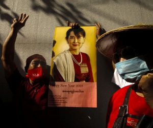 epa10373655 A Myanmar migrant worker living in Thailand holds a picture of Myanmar democracy icon Aung San Suu Kyi at a rally outside the Myanmar embassy in Bangkok, Thailand, 19 December 2022. Myanmar migrant workers rallied outside the Myanmar embassy to mark the International Migrants Day which was observed the previous day on 18 December, to protest against Myanmar's State Administration Council and in support of Aung San Suu Kyi, the 1991 Nobel Peace Prize laureate and former State Counsellor of Myanmar and Minister of Foreign Affairs.  EPA/DIEGO AZUBEL
