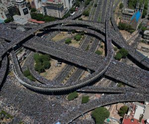 epa10374999 Aerial photo taken with a drone shows fans of Argentinian national soccer team celebrate during the victory parade of the Argentinian national soccer team in Buenos Aires, Argentina, 20 December 2022. Argentina defeated France 4-2 in a penalty shoot-out after a 3-3 draw to win the FIFA World Cup 2022 soccer tournament.  EPA/Alan Eidelstein