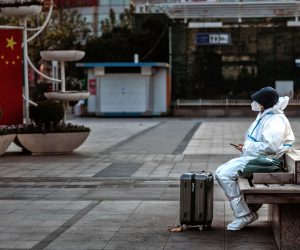 epa10375443 A man wearing protective gear sits at the Shanghai Railway Station, in Shanghai, China, 21 December 2022. According to the National Health Commission report on 21 December, China reported 3,049 locally transmitted Covid-19 cases. After easing domestic Covid-19 restrictions, Guangzhou and Chengdu made further adjustments to international passenger's quarantine policy. On 20 December, Chengdu implemented a 2+3 quarantine policy where passengers must stay 2 days in centralised quarantine and 3 days at home.  EPA/ALEX PLAVEVSKI