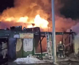 epa10377554 A handout photo from video made available by by Press Service of the Ministry of the Russian Federation for Civil Defence, Emergencies and Elimination of Consequences of Natural Disasters, shows rescuers working at an illegal nursing home during a fire, in Kemerovo city, Russia, 24 December 2022. Emergencies ministry said that 22 people were killed in the fire.  MANDATORY CREDIT BEST QUALITY AVAILABLE HANDOUT EDITORIAL USE ONLY/NO SALES