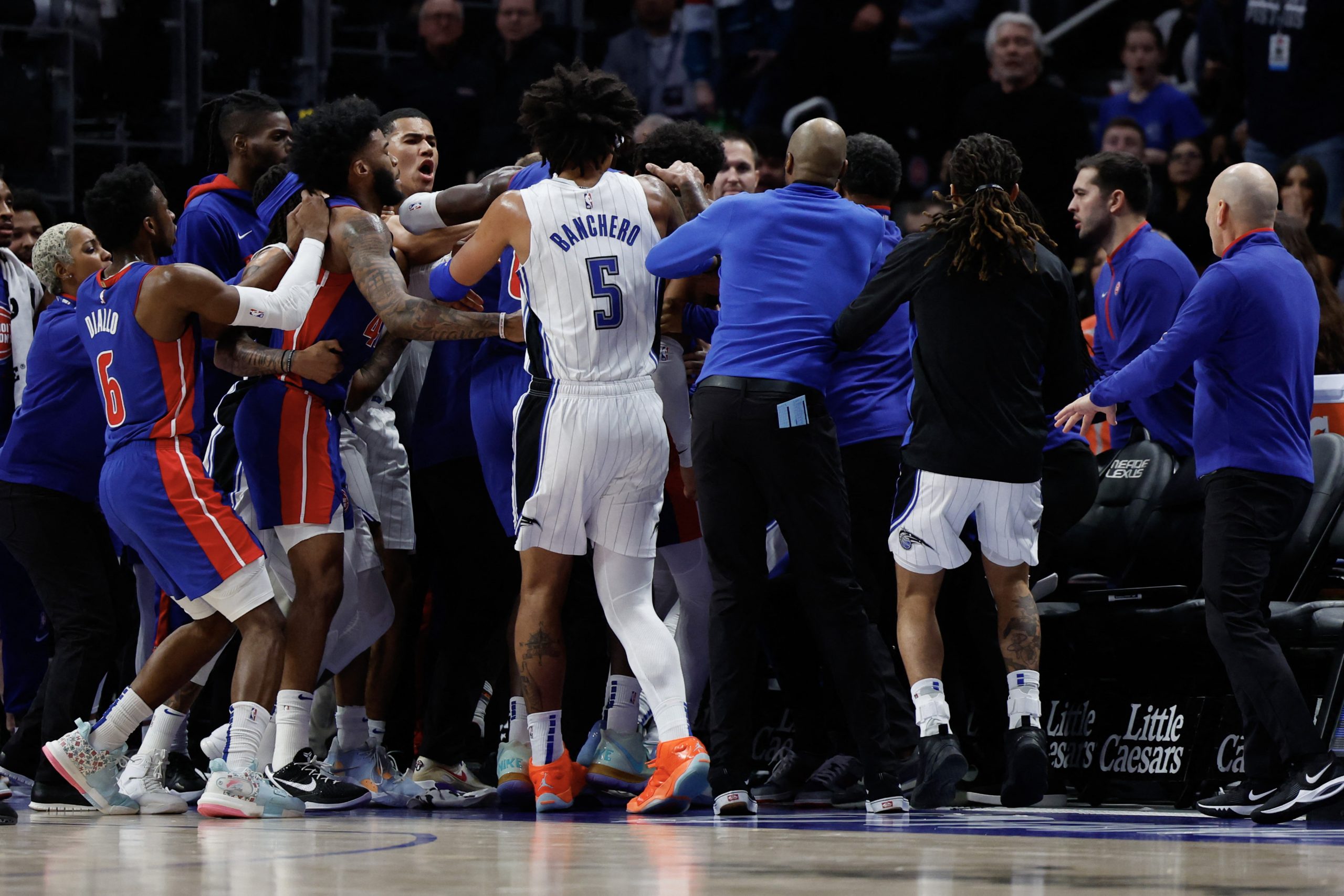 Dec 28, 2022; Detroit, Michigan, USA;  Orlando Magic forward Paolo Banchero (5) rush towards the the Detroit Pistons bench in the first half at Little Caesars Arena. Mandatory Credit: Rick Osentoski-USA TODAY Sports Photo: Rick Osentoski/REUTERS