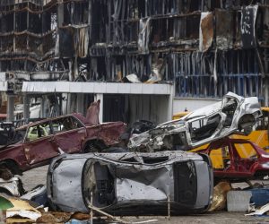epaselect epa10360649 Destroyed vehicles are piled beside a shopping mall which was destroyed during fighting in Mariupoll, Ukraine, 10 December 2022 (issued 11 December 2022). An estimate 250,000 inhabitants have left the city, about 300,000 still remain. During the hostilities, up to 70 percent of the housing stock of Mariupol was destroyed and about 5,000 civilians were killed due to fighting and shelling, Konstantin Ivashchenko, the new mayor of the city, said. City authorities prepare residential buildings for winter and change all central heating systems in Mariupol, where by the end of the year at least 1,000 residential buildings, social and cultural facilities will be connected to heat, said Russian Deputy Prime Minister Marat Khusnullin. The government of the self-proclaimed Donetsk People's Republic (DPR) reported that 129,000 square meters of new housing will appear next year in Mariupol. More than 5,000 builders are working on the restoration of the city. Mariupol is expected to be completely rebuilt in three years.  EPA/SERGEI ILNITSKY