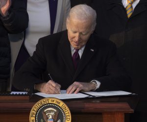 epa10364558 US President Joe Biden signs the Respect for Marriage Act beside lawmakers, members of the Biden administration and supporters; during a ceremony on the South Lawn of the White House in Washington, DC, USA, 13 December 2022. The Respect for Marriage Act protects same-sex marriage and interracial marriage.  EPA/MICHAEL REYNOLDS