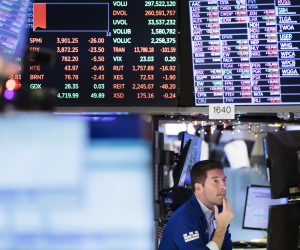 epa10368771 A trader working with boards of stock price information on the floor of the New York Stock Exchange in New York, New York, USA, on 16 December 2022. Stocks were again down in morning trading as investors are reportedly reacting with concern about the  U.S. Federal Reserve’s decision this week to continue interest rate hikes.  EPA/JUSTIN LANE