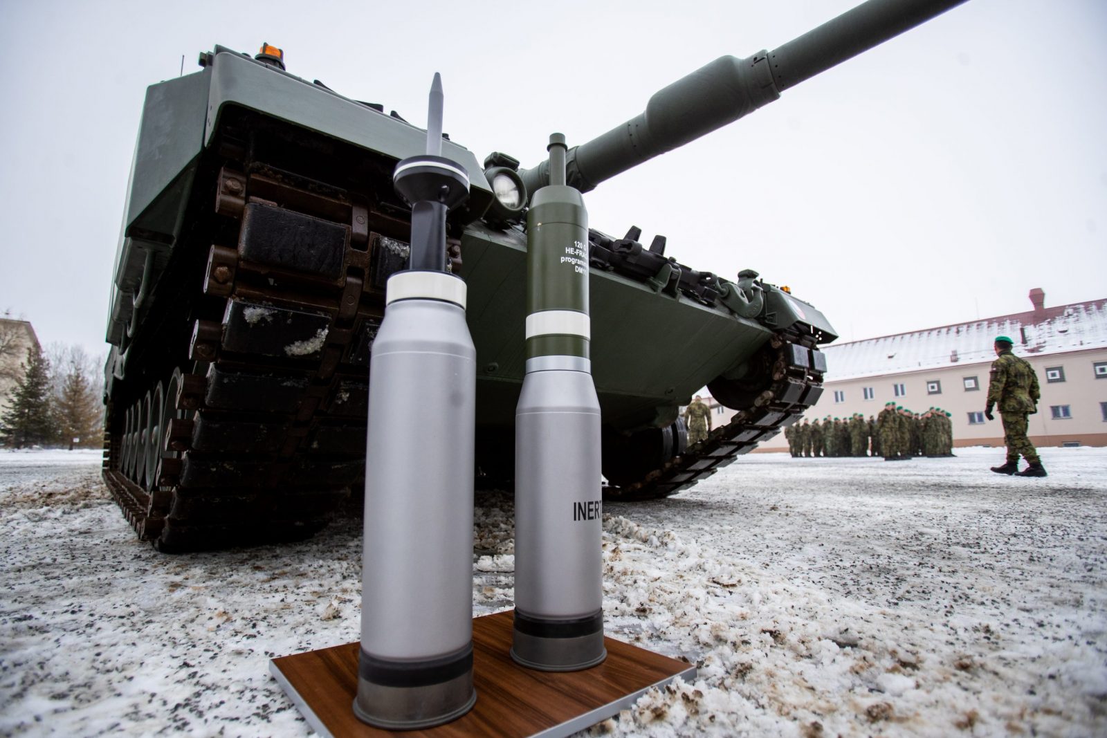 epa10375564 Ammunition standing in front of a Leopard 2A4 tank during a ceremony for the hand over of the symbolic key of the tank to the Czech army, in Praslavice, Czech Republic, 21 December 2022. The Czech Republic is to receive a total of 14 Leopard 2A4 tanks and a Bueffel armored recovery vehicle as a gift from Germany under the German government's 'Ringtausch' programme in return for deliveries of older tanks from Czech army depots to Ukraine. In addition to the tanks, the delivery will include an initial package of spare parts, ammunition and a three-year service support from the supplier, which includes training of Czech soldiers. The value of the donation exceeds 3.85 billion Czech crown (159 million euro). The rest of the military equipment is expected to be delivered to the Czech Republic next year.  EPA/VLADIMIR PRYCEK