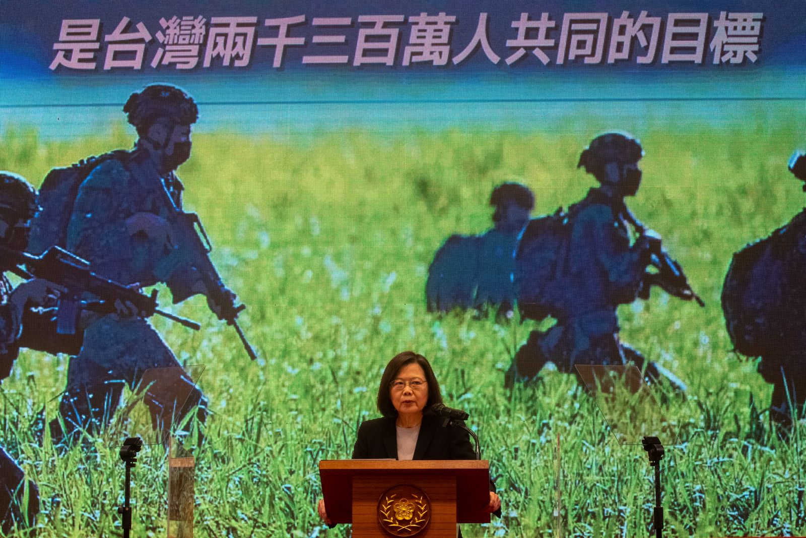 epa10379040 Taiwan President Tsai Ing-wen speaks in front of a screen showing defense forces, during a press conference in Taipei, Taiwan, 27 December 2022. Tsai addresses national security issues including the recent Chinese military incursion above Taiwan airspace on 26 December.  EPA/RITCHIE B. TONGO