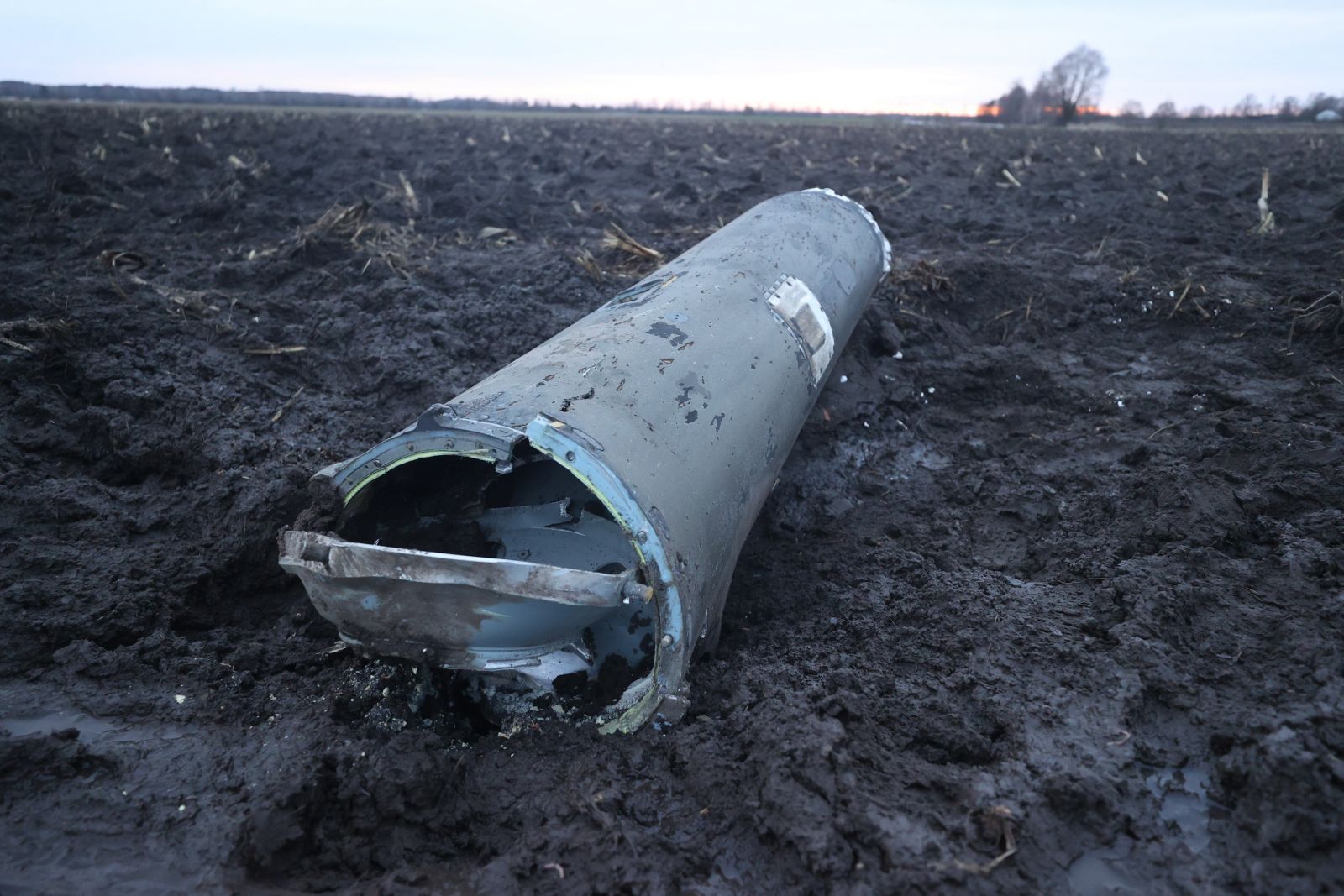 epa10382520 A handout photo made available by Belta news agency shows a fragment of a missile in a field outside the village of Harbacha, Grodno region, Belarus, 29 December 2022 (issued 30 December 2022). The press service of the Ministry of Defense of Belarus said that a missile fired from the territory of Ukraine was shot down on 29 December morning by air defense forces after it crossed Belarus' border and entered its airspace. According to a Belarus investigation, it was preliminary established that the wreckage belonged to an S-300 anti-aircraft guided missile fired from the territory of Ukraine.  EPA/VADZIM YAKUBIONAK/BELTA HANDOUT -- MANDATORY CREDIT -- HANDOUT EDITORIAL USE ONLY/NO SALES