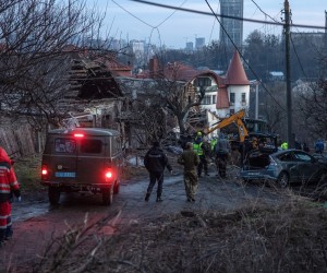 epa10384026 Medical workers, together with the police and investigators work at the site of the Russian missile attack, in Kyiv, Ukraine, 31 December 2022. Russian missiles targeted major cities across Ukraine on 31 December prior to the New Year celebration. Kyiv Mayor Vitaliy Klitschko reported explosions and destruction in three districts of the capital. At least one person was killed, Klitschko said. Russian troops entered Ukraine on 24 February 2022 starting a conflict that has provoked destruction and a humanitarian crisis.  EPA/ROMAN PILIPEY