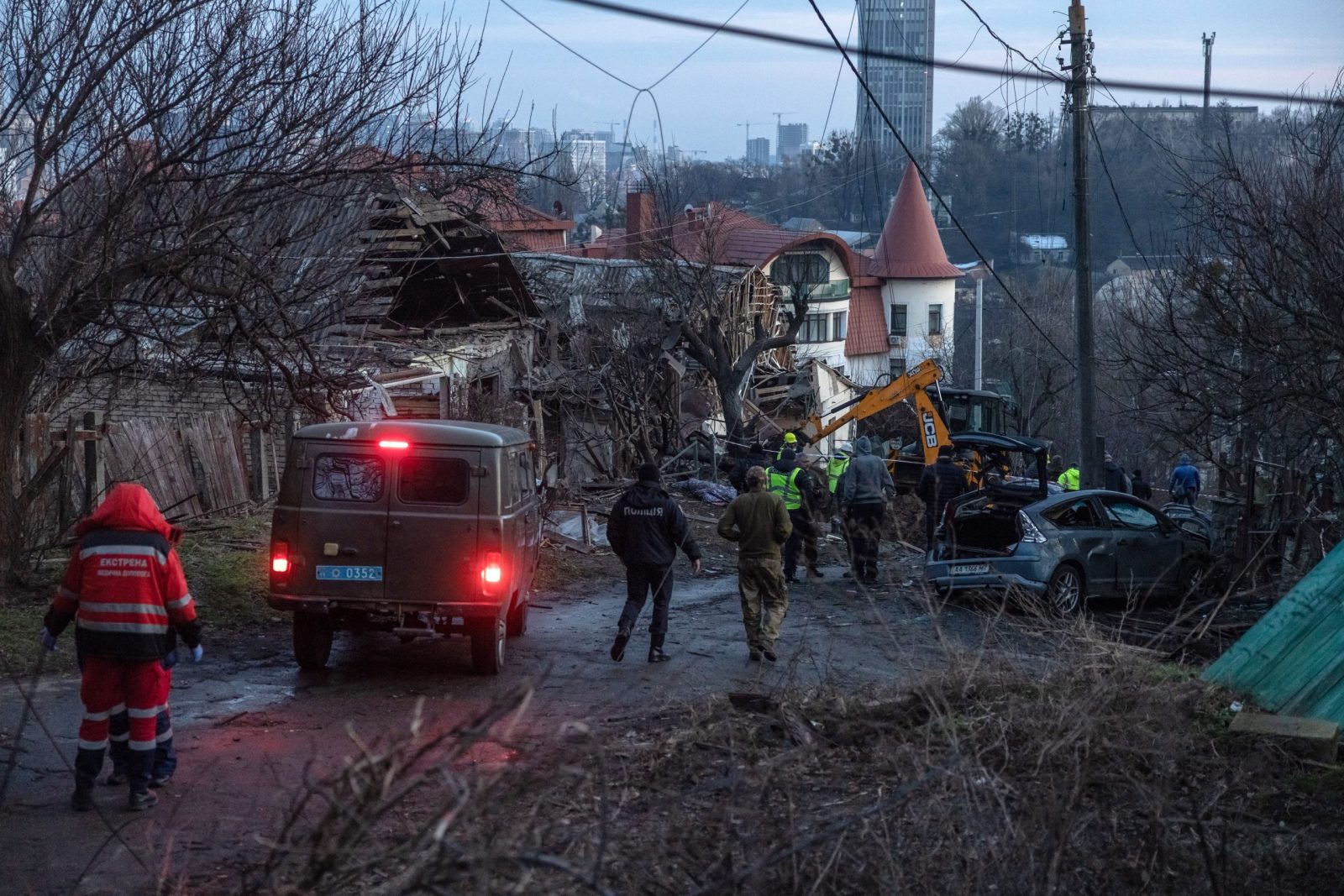 epa10384026 Medical workers, together with the police and investigators work at the site of the Russian missile attack, in Kyiv, Ukraine, 31 December 2022. Russian missiles targeted major cities across Ukraine on 31 December prior to the New Year celebration. Kyiv Mayor Vitaliy Klitschko reported explosions and destruction in three districts of the capital. At least one person was killed, Klitschko said. Russian troops entered Ukraine on 24 February 2022 starting a conflict that has provoked destruction and a humanitarian crisis.  EPA/ROMAN PILIPEY