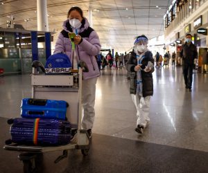epa10384869 Passengers walk inside the Beijing Capital International Airport in Beijing, China, 01 January 2023. The UK and France have joined the USA, Australia, Canada, Spain, Italy, Israel, Japan, South Korea, Morocco, Malaysia, Taiwan and India in imposing curbs for incoming travelers from China as the country continues to experience a surge in COVID-19 with no figures available as China's National Health Commission (NHC) stopped publishing data on 25 December 2022.  EPA/MARK R. CRISTINO
