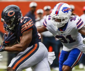 epa10386808 (FILE) - Chicago Bears running back Khalil Herbert (C) runs for a touchdown between Buffalo Bills cornerback Rachad Wildgoose (L) and Buffalo Bills safety Damar Hamlin (R) during the NFL preseason game between the Buffalo Bills and the Chicago Bears at Soldier Field in Chicago, Illinois, USA, 21 August 2021 (issued 03 January 2023.) Twenty-four year old Damar Hamlin collapsed on the field during the Bills NFL game against the Cincinnati Bengals and was administered CPR before being taken to a local hospital 02 January 2023. Players left the field and the game has been suspended by the NFL for the night.  EPA/TANNEN MAURY