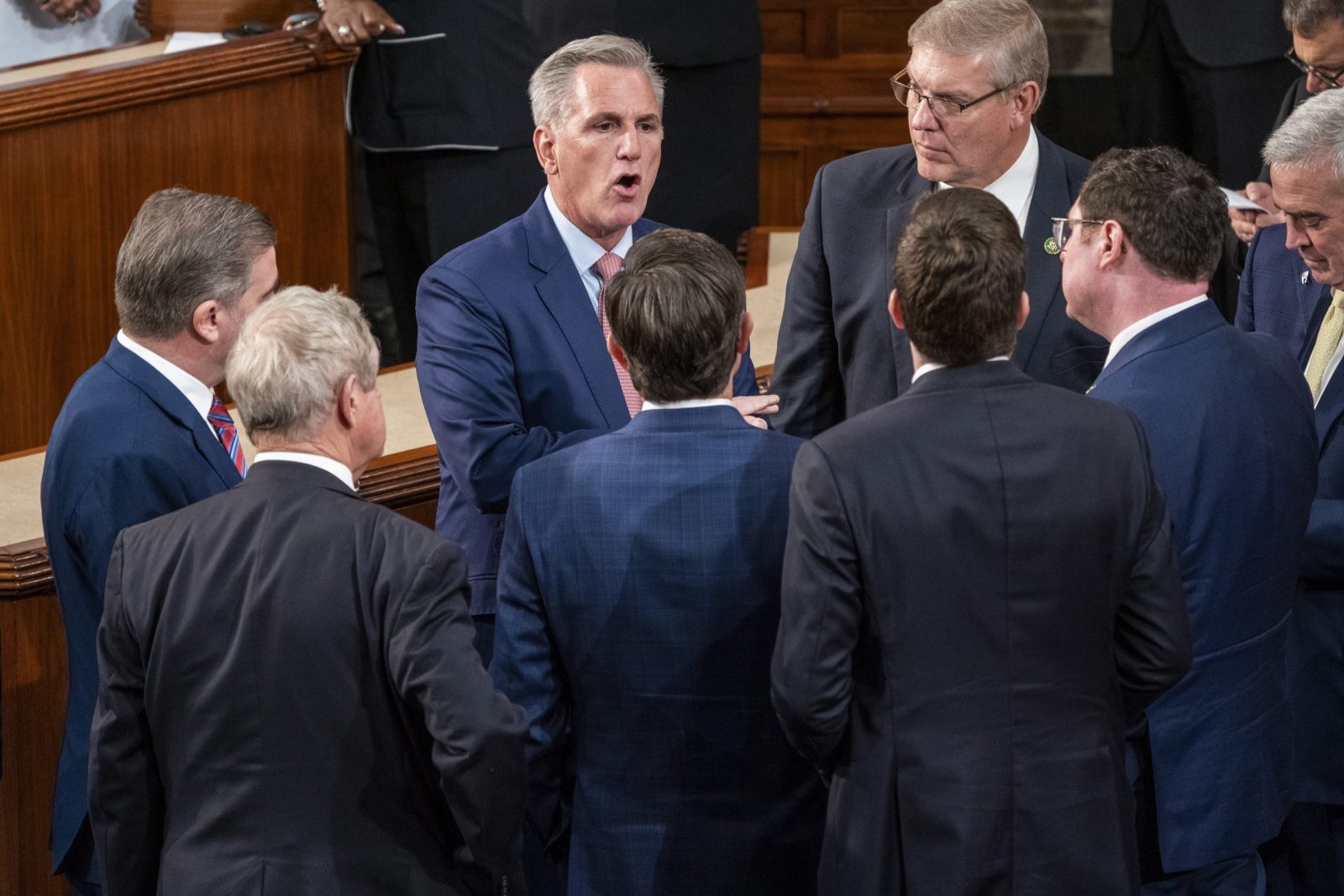 epa10387830 House Republican Leader Kevin McCarthy talks with colleagues as the results of the second vote for Speaker of the House is tabulated during the opening session of the 118th Congress on the House floor in the US Capitol in Washington, DC, USA 03 January 2023. House Republican Leader Kevin McCarthy is facing serious opposition from his own Republican caucus putting his bid for Speaker of the House in jeopardy.  EPA/SHAWN THEW