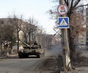 epa10390837 Ukrainian forces drive a tank across a street in the city of Bakhmut, Donetsk area, Ukraine, 04 January 2023 (issued 05 January 2023). Heavy fighting is taking place in the region. Russian troops entered Ukraine on 24 February 2022 starting a conflict that has provoked destruction and a humanitarian crisis.  EPA/GEORGE IVANCHENKO